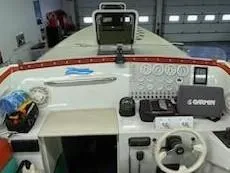 Slide: The Image of 1995 Cigarette 38 Signature Edition boat dashboard with gauges and controls. - 11