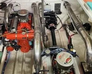 Slide: The Image of Engine compartment of a 1995 Cigarette 38 Signature Edition boat, showcasing dual engines. - 19