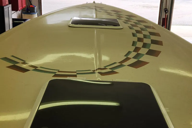 Slide: The Image of 1995 Cigarette 38 Signature Edition boat with checkered pattern on deck. - 20