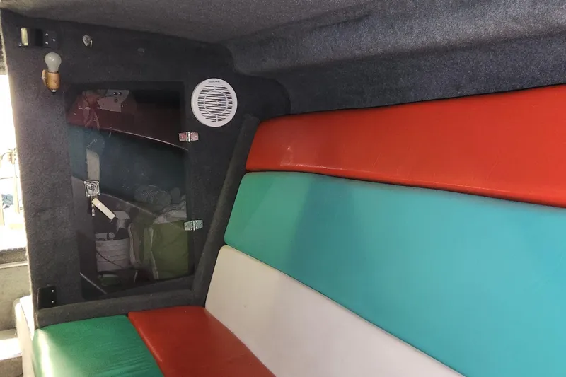 Slide: The Image of Interior of 1995 Cigarette 38 Signature Edition boat with colorful seating and speaker. - 21