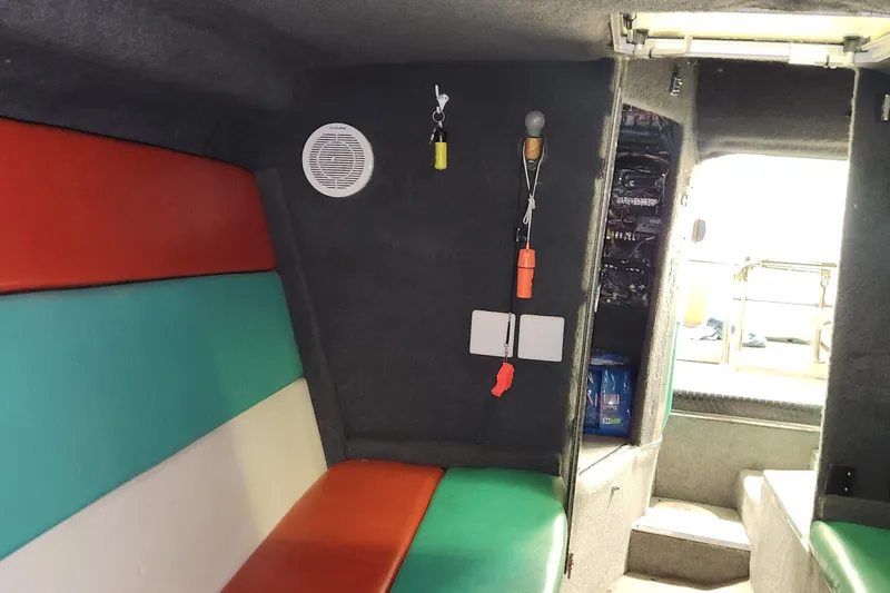 Slide: The Image of Interior of 1995 Cigarette 38 Signature Edition boat with colorful seating and equipment. - 22