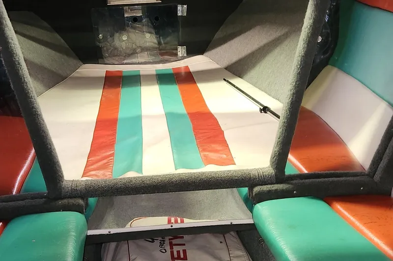 Slide: The Image of Interior of a 1995 Cigarette 38 Signature Edition boat with colorful seating. - 23
