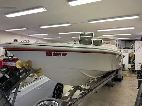 Slide: The Image of 1995 Cigarette 38 Signature Edition boat in garage, on trailer, under fluorescent lights. - 3