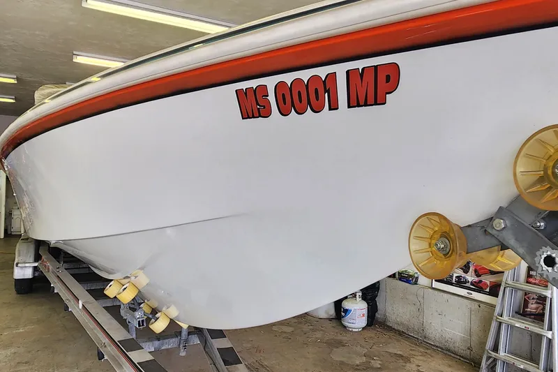 Slide: The Image of 1995 Cigarette 38 Signature Edition boat on trailer in garage. - 5