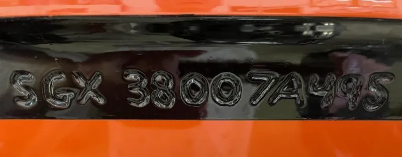 Slide: The Image of VIN number on 1995 Cigarette 38 Signature Edition boat, black on orange background. - 7