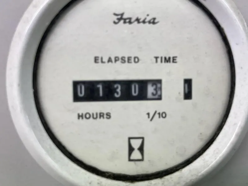 Slide: The Image of Faria elapsed time gauge showing 1303.1 hours on Cigarette 38 Signature Edition, 1995 model. - 9