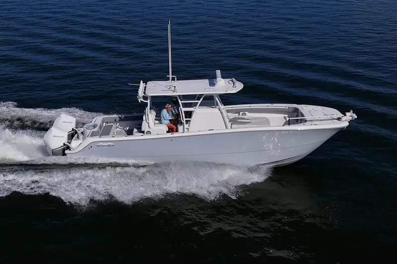 Slide: The Image of 2022 Invincible 33 Catamaran cruising on open water, side view. - 1