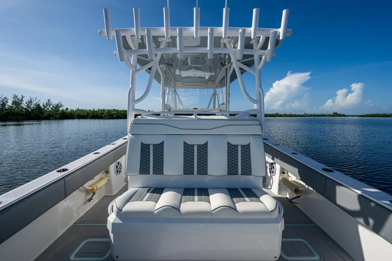 Slide: The Image of 2022 Invincible 33 Catamaran on calm water, featuring sleek seating and modern design. - 21