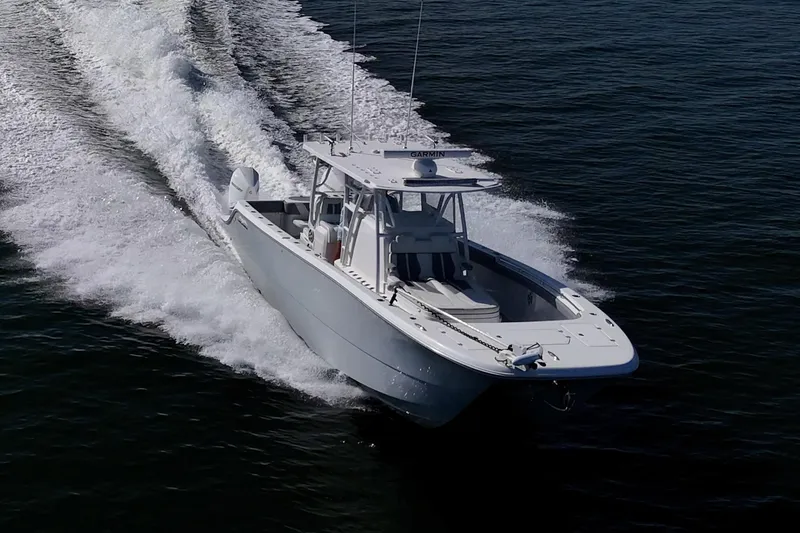 Slide: The Image of 2022 Invincible 33 Catamaran cruising on open water, showcasing sleek design and performance. - 40