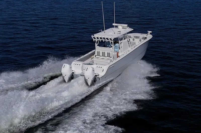 Slide: The Image of 2022 Invincible 33 Catamaran cruising on open water, showcasing powerful dual engines. - 41