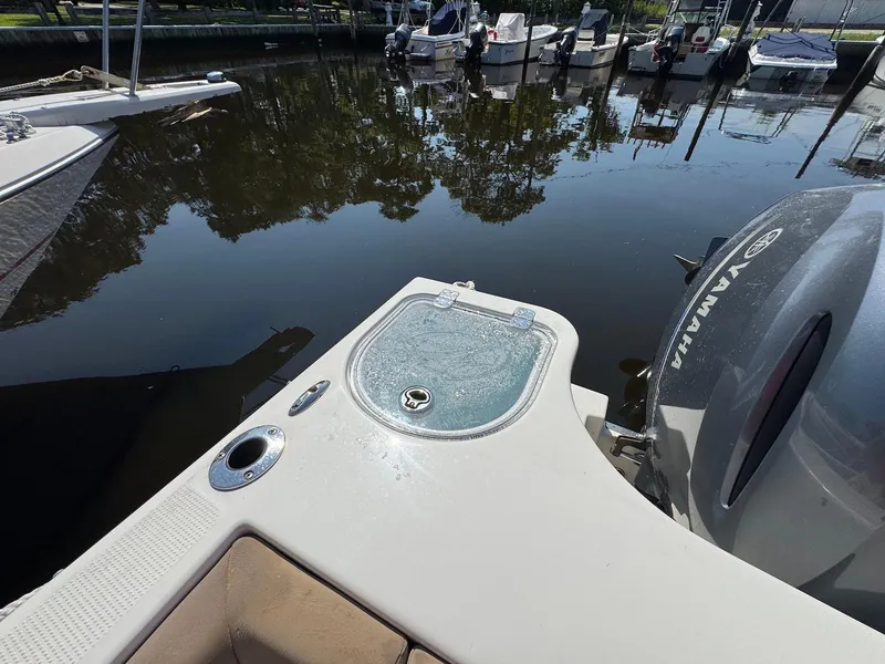 Slide: The Image of 2017 Sailfish 275 DC boat with Yamaha engine, docked near calm water. - 15
