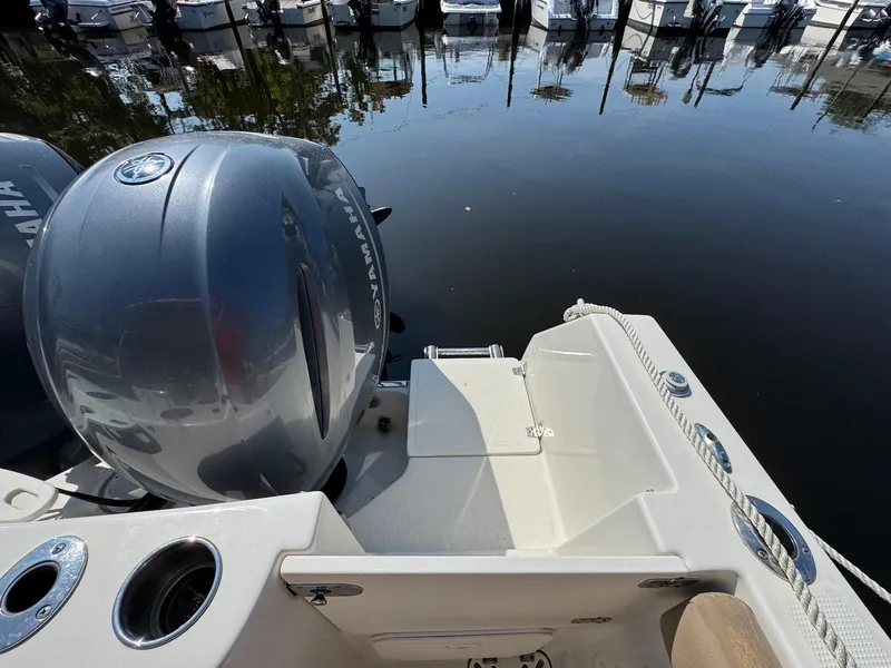 Slide: The Image of 2017 Sailfish 275 DC boat with Yamaha engine, docked at marina. - 16