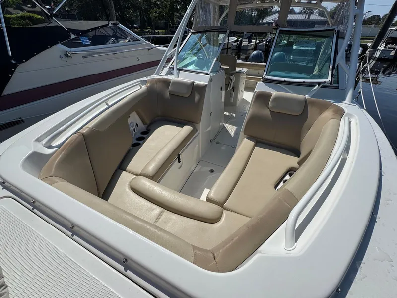 Slide: The Image of 2017 Sailfish 275 DC boat interior with beige seating and spacious layout. - 3