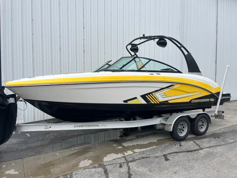 The Image of 2016 Chaparral Vortex 223 VRX boat on trailer, yellow and white design. - 0