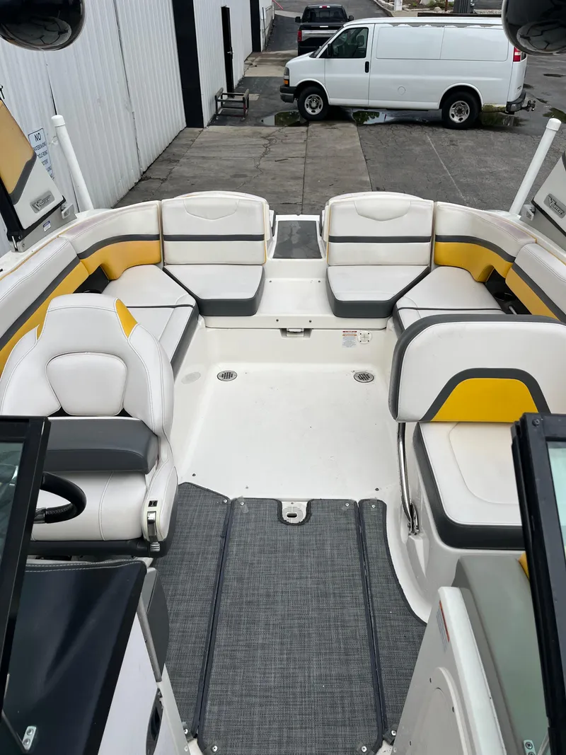 Slide: The Image of 2016 Chaparral Vortex 223 VRX boat interior with white and yellow seating. - 13