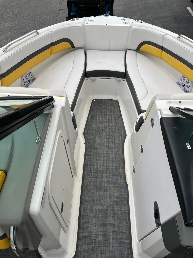 Slide: The Image of 2016 Chaparral Vortex 223 VRX boat interior with white and yellow seating. - 14