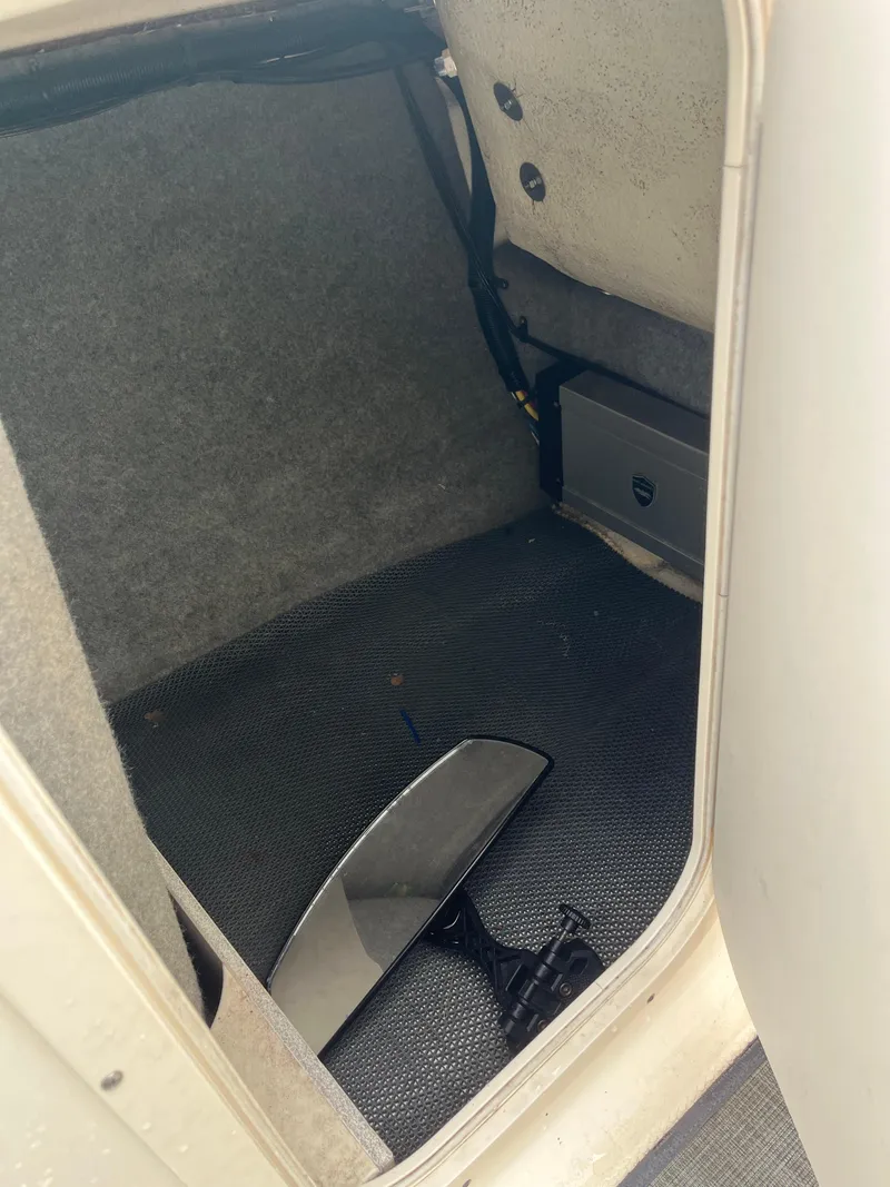 Slide: The Image of Storage compartment of a 2016 Chaparral Vortex 223 VRX boat with a mirror inside. - 16