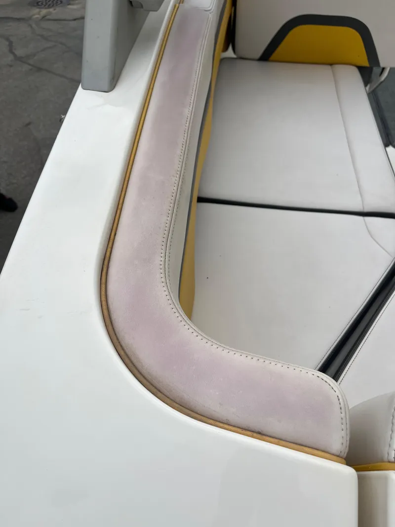 Slide: The Image of 2016 Chaparral Vortex 223 VRX boat interior with white and yellow seating. - 17