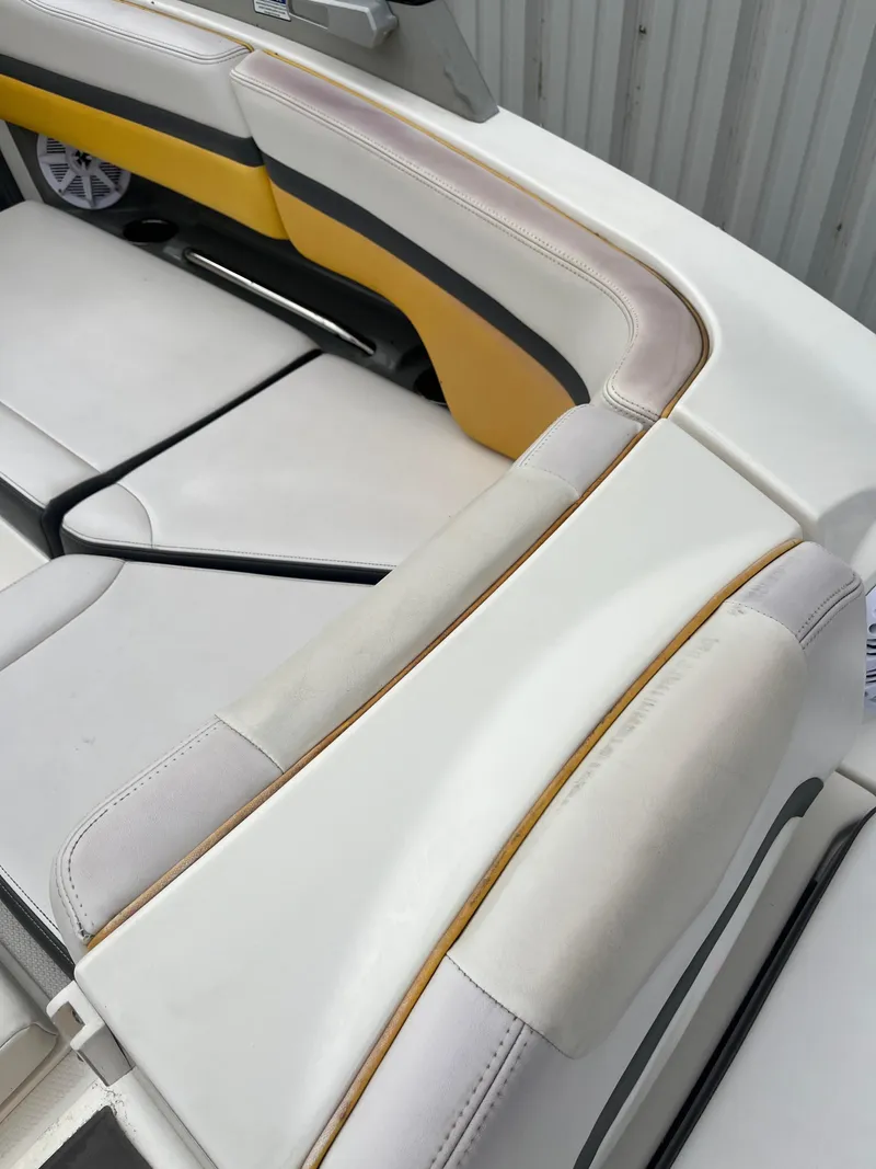 Slide: The Image of 2016 Chaparral Vortex 223 VRX boat interior with white and yellow seating. - 19