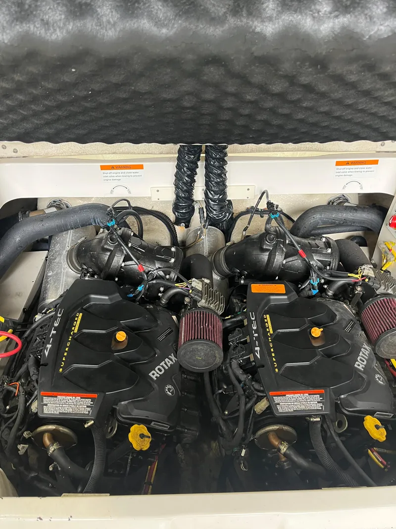 Slide: The Image of Twin Rotax engines in a 2016 Chaparral Vortex 223 VRX boat. - 21