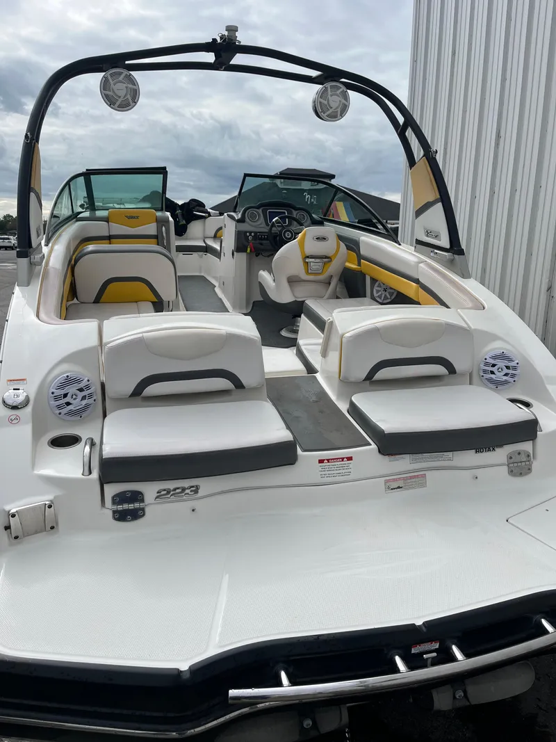 Slide: The Image of 2016 Chaparral Vortex 223 VRX boat with white and yellow interior, rear view. - 4