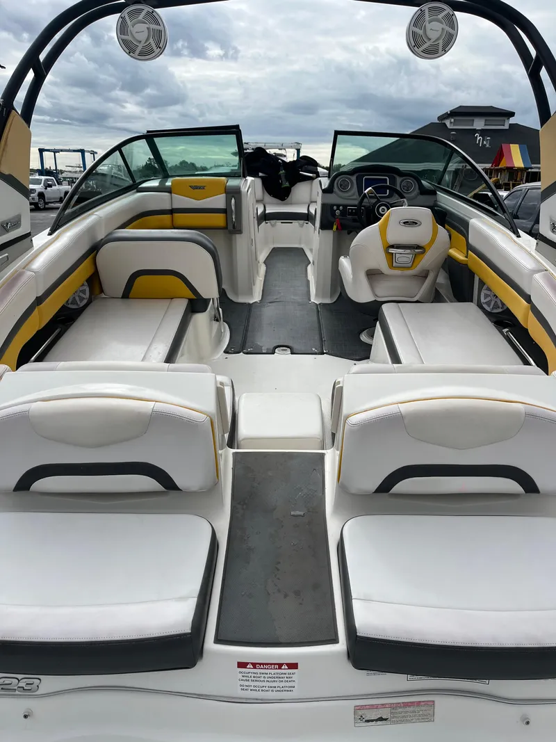 Slide: The Image of 2016 Chaparral Vortex 223 VRX boat interior with white and yellow seating. - 5