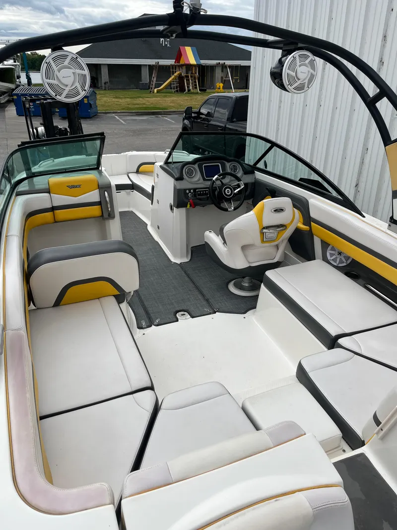 Slide: The Image of 2016 Chaparral Vortex 223 VRX boat interior with seating and steering console. - 6