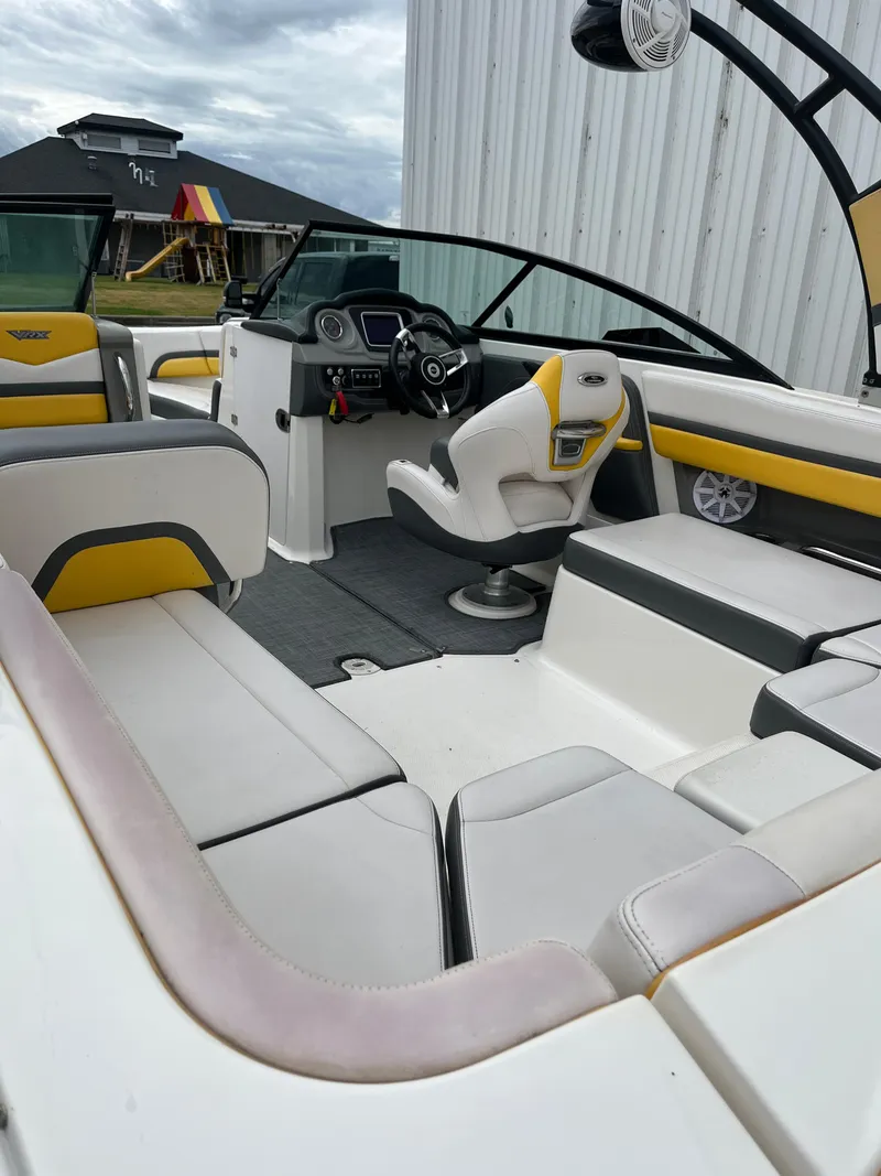 Slide: The Image of 2016 Chaparral Vortex 223 VRX boat interior with yellow and white seating. - 7