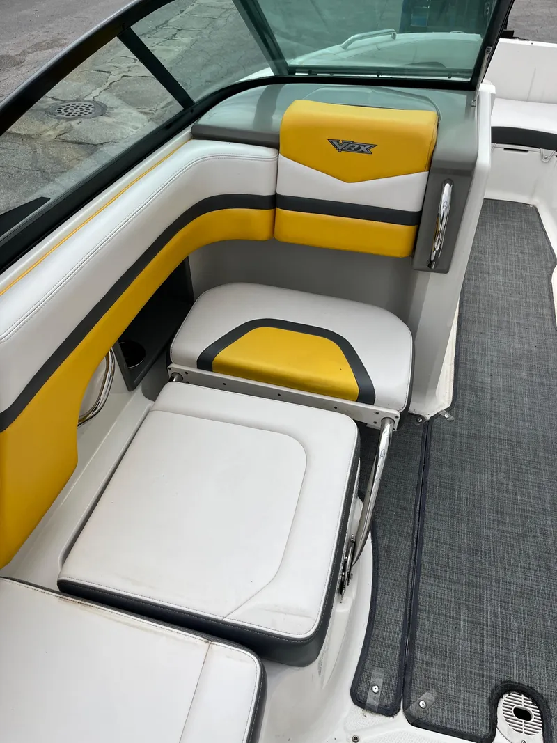 Slide: The Image of 2016 Chaparral Vortex 223 VRX boat interior with yellow and white seating. - 8