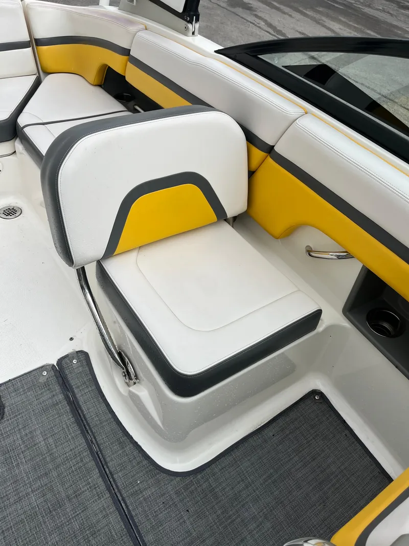 Slide: The Image of 2016 Chaparral Vortex 223 VRX boat interior with yellow and white seating. - 9