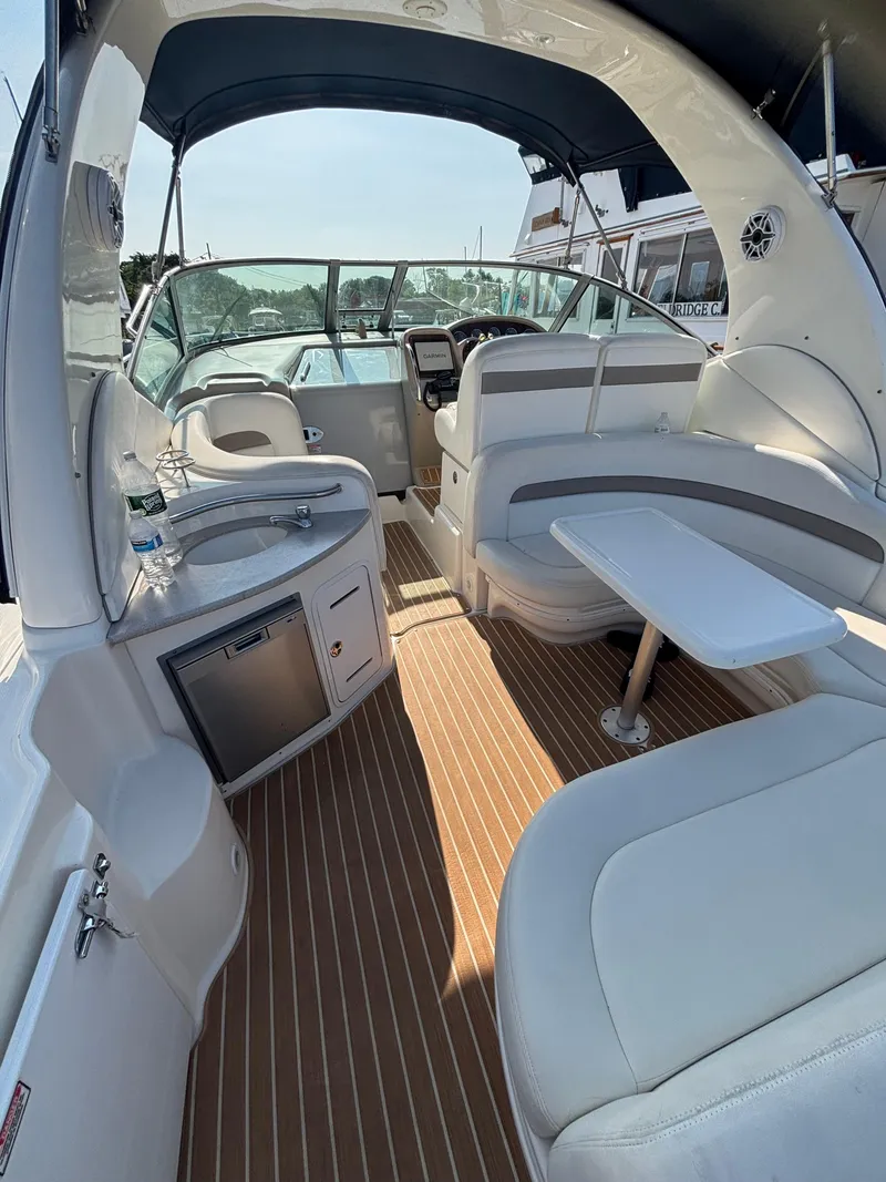 Slide: The Image of Interior of 2004 Sea Ray 320 Sundancer boat with seating and helm. - 16