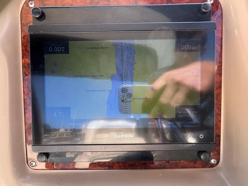 Slide: The Image of Garmin navigation screen on 2004 Sea Ray 320 Sundancer displaying marine map and coordinates. - 29