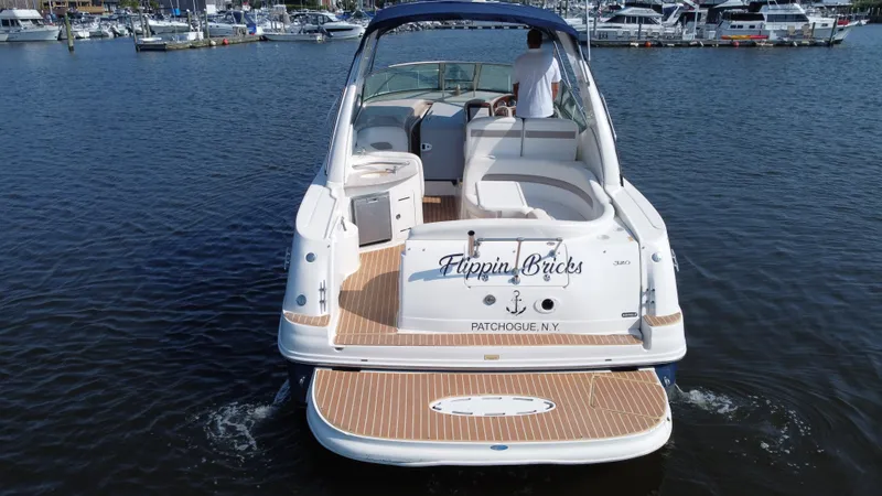 Slide: The Image of 2004 Sea Ray 320 Sundancer boat on water, rear view, Patchogue, NY. - 4