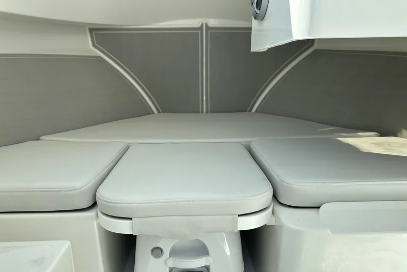 Slide: The Image of 2025 Parker 2420 Sport Cabin interior with cushioned seating and modern design. - 7