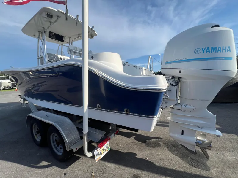 Slide: The Image of 2012 NauticStar 2500XS Offshore boat with Yamaha outboard engine on trailer. - 10