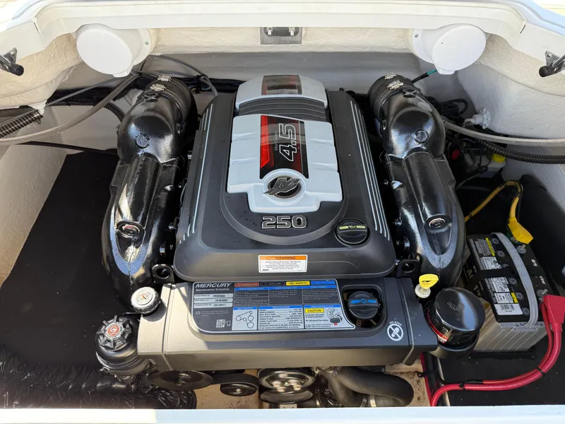 Slide: The Image of 2017 Crownline 205 SS boat engine compartment with Mercury 4.5L 250 HP engine. - 11