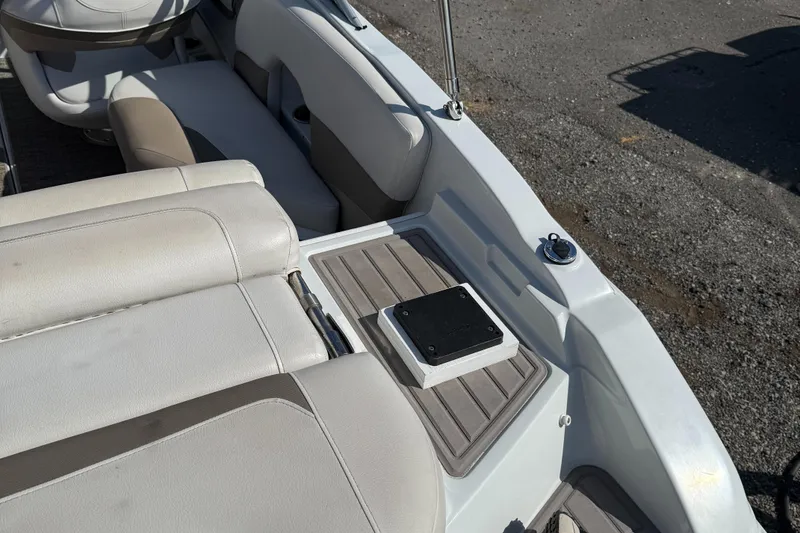 Slide: The Image of Interior of a 2017 Crownline 205 SS boat with beige seating and deck details. - 8