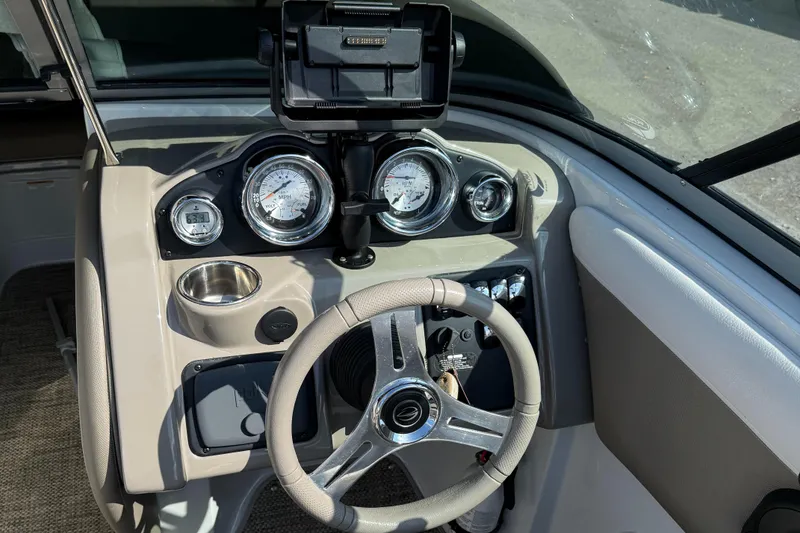 Slide: The Image of 2017 Crownline 205 SS boat dashboard with steering wheel and gauges. - 9