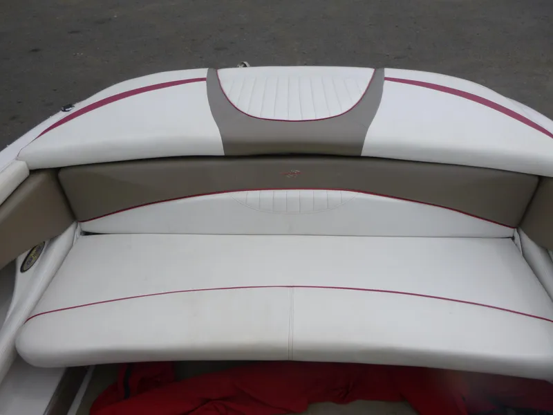 Slide: The Image of 2004 Four Winns 180 Horizon boat seating with white and beige upholstery. - 10