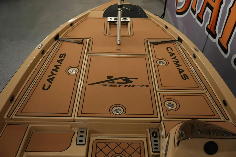 Slide: The Image of 2025 Caymas XS 20 PRO boat interior with steering wheel and dashboard. - 13