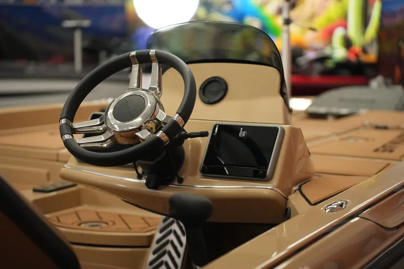 Slide: The Image of Steering wheel and dashboard of 2025 Caymas XS 20 PRO boat. - 21