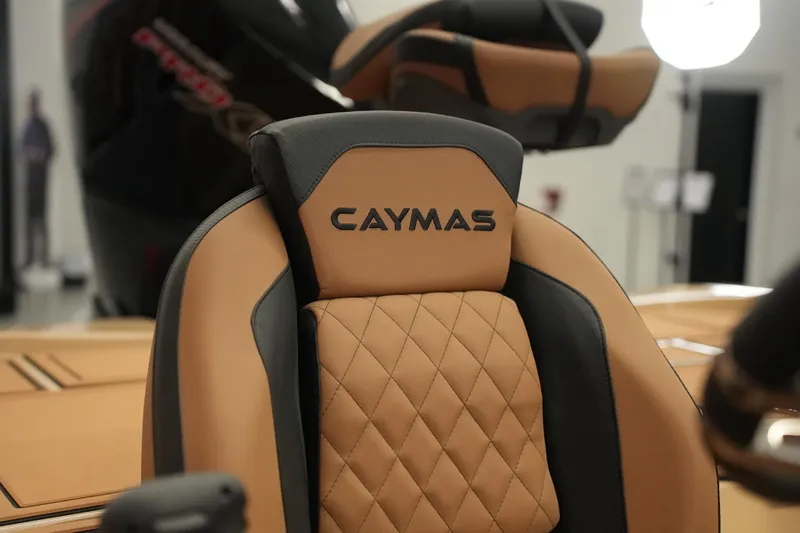 Slide: The Image of Control panel of 2025 Caymas XS 20 PRO boat with labeled switches and key ignition. - 22