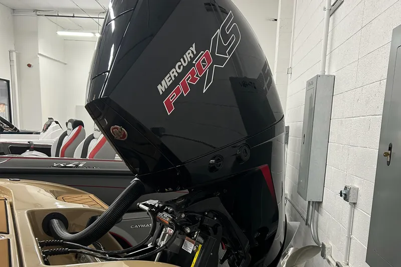 Slide: The Image of 2025 Caymas XS 21 boat with Mercury Pro XS engine in showroom. - 4