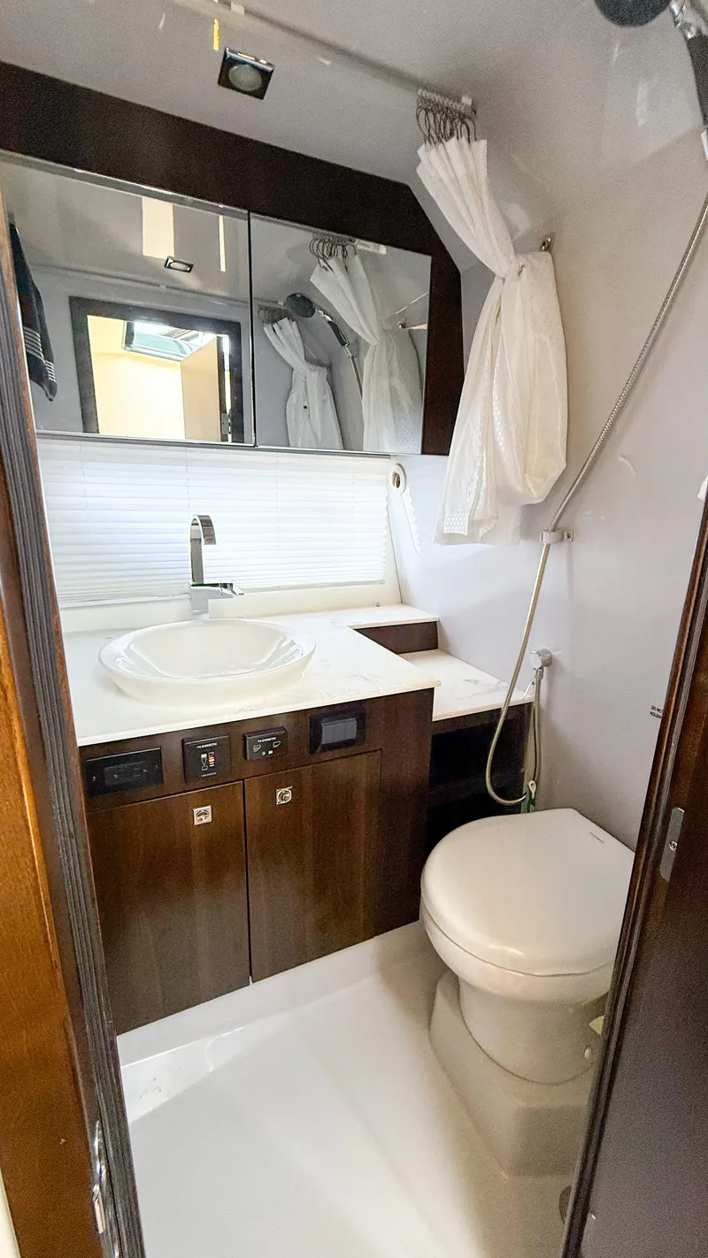Slide: The Image of Luxurious bathroom in 2022 Cruisers Yachts 38 GLS with modern fixtures and elegant design. - 18