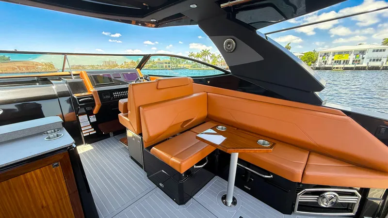 Slide: The Image of 2022 Cruisers Yachts 38 GLS interior with leather seating and modern dashboard. - 10