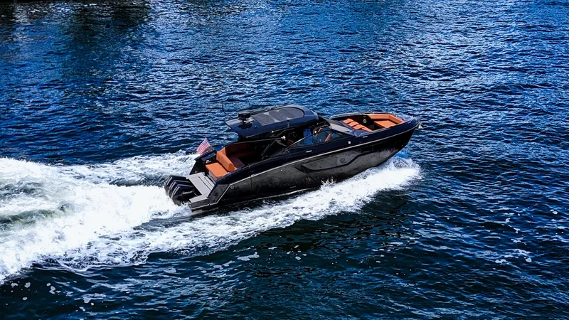 Slide: The Image of 2022 Cruisers Yachts 38 GLS cruising on open water, showcasing sleek design and performance. - 5