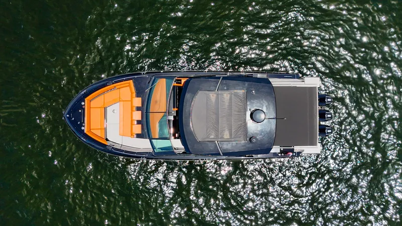 Slide: The Image of Aerial view of 2022 Cruisers Yachts 38 GLS on shimmering water. - 8
