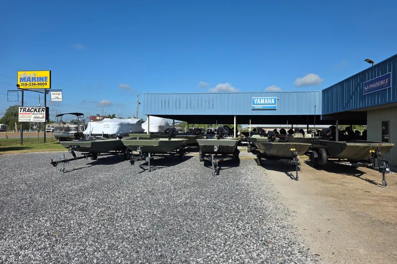 Slide: The Image of 2025 Weldcraft 1652-RL boats displayed at dealership under clear blue sky. - 9