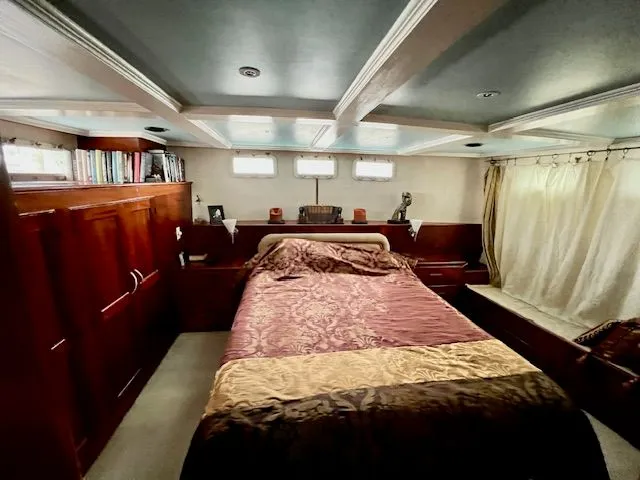 Slide: The Image of Luxurious bedroom on a 1971 Broward motor yacht. - 12
