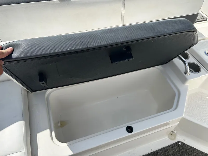 Slide: The Image of Open storage compartment on a 2016 Sea Ray 21 SPX OB boat. - 14